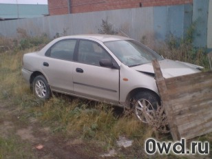 Битый автомобиль Mazda 323